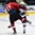GRAND FORKS, NORTH DAKOTA - APRIL 14: Switzerland's Marco Miranda #17 and LatviaÕs Pauls Svars #12 collide during preliminary round action at the 2016 IIHF Ice Hockey U18 World Championship. (Photo by Matt Zambonin/HHOF-IIHF Images)

